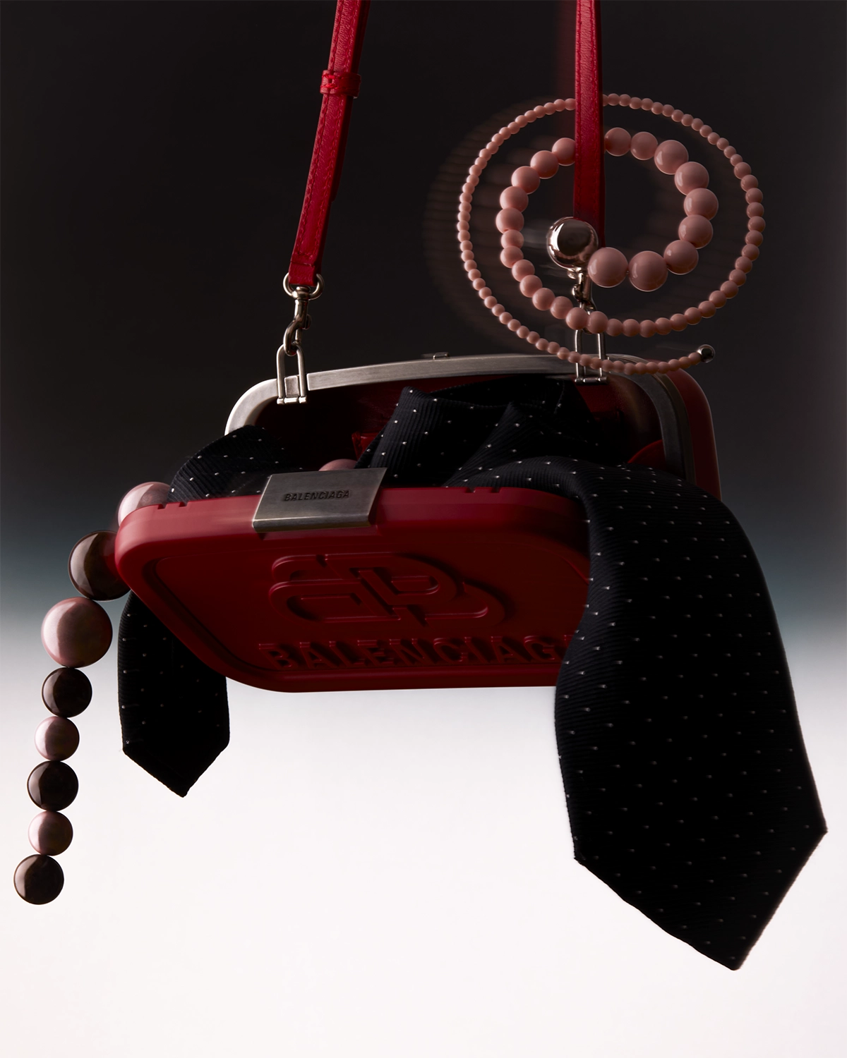 Pien (model) for shadow ban, 2024 sitting on a metalic chair